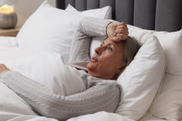 Woman in bed having trouble sleeping